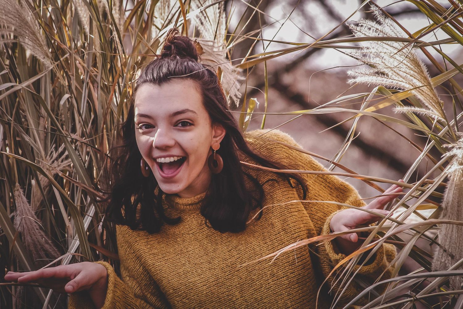 Outdoor portrait in the woods capturing candid emotions and smiles