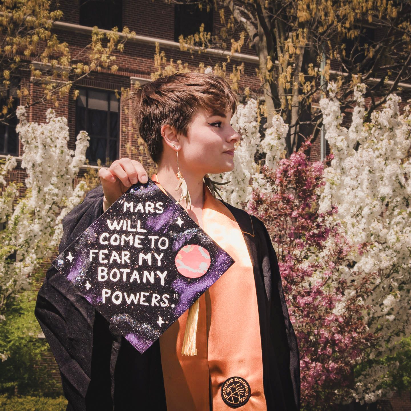 Lifestyle graduation photography capturing a student celebrating their college graduation