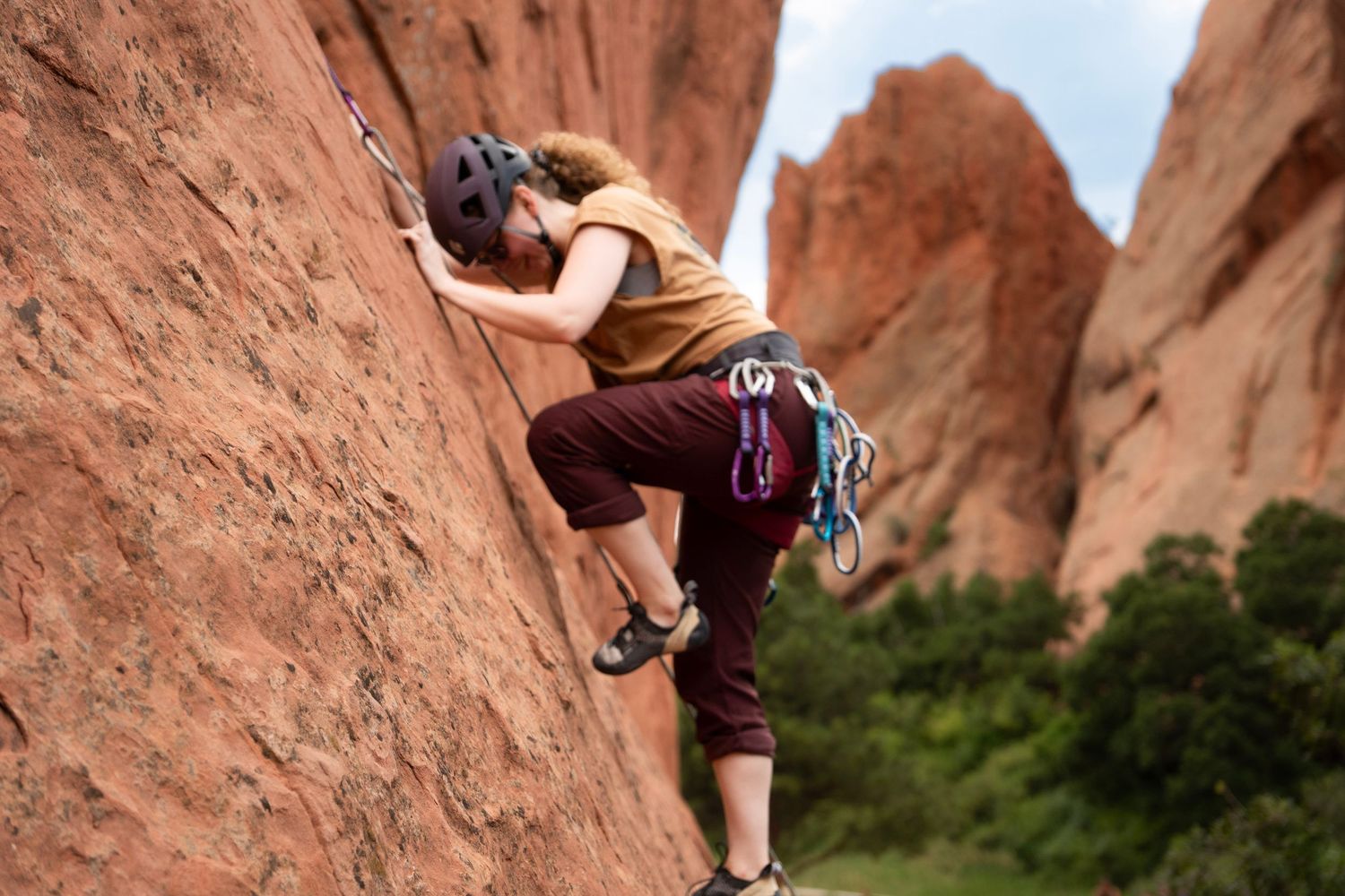 Documentary-style individual photography capturing natural expressions in Colorado while rock climbing at garden on the gods in colorado