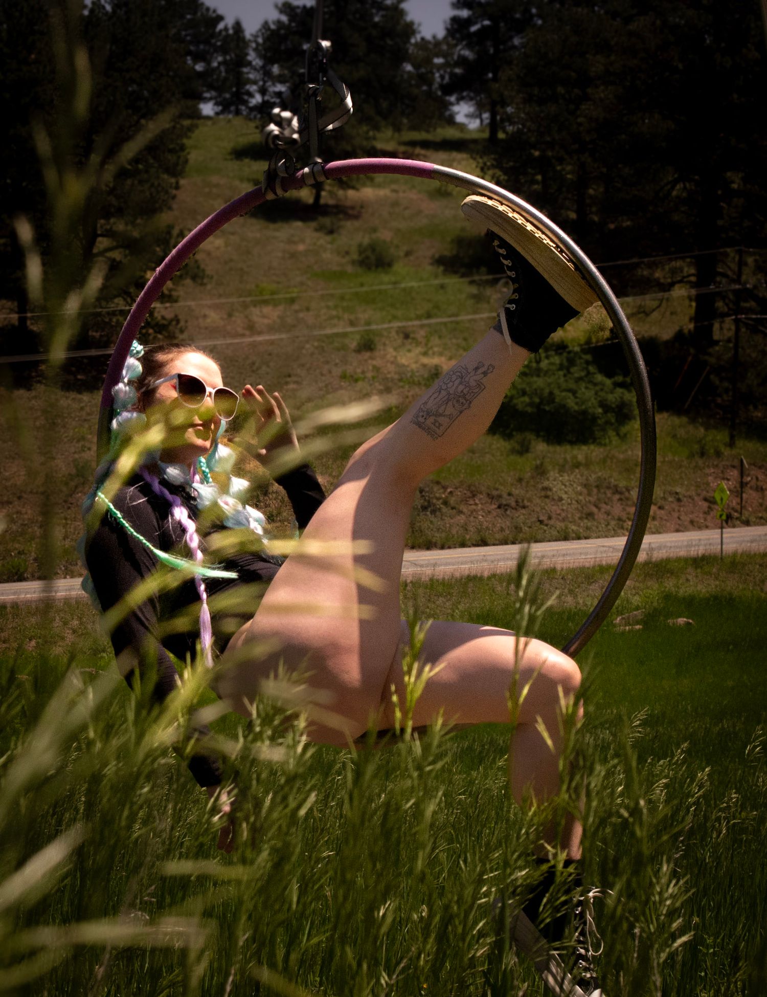 Shay Godfrey capturing a performer on the Lyra surrounded by Colorado wilderness