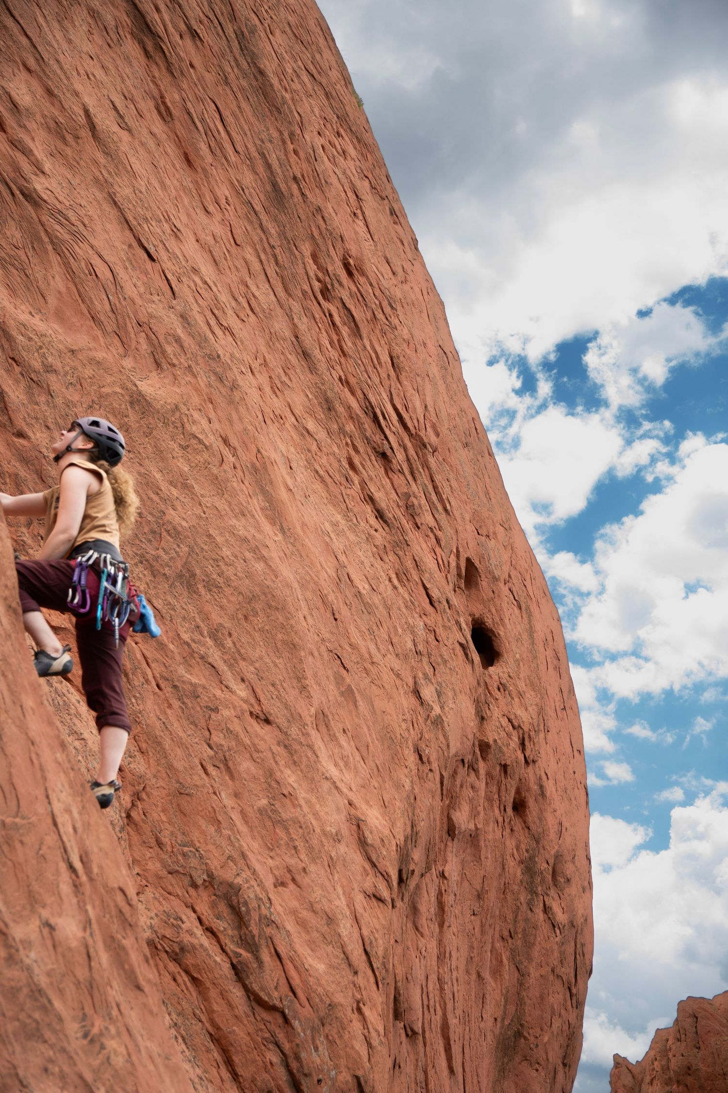 Adventure photography of a person rock climbing at garden on the gods in Colorado
