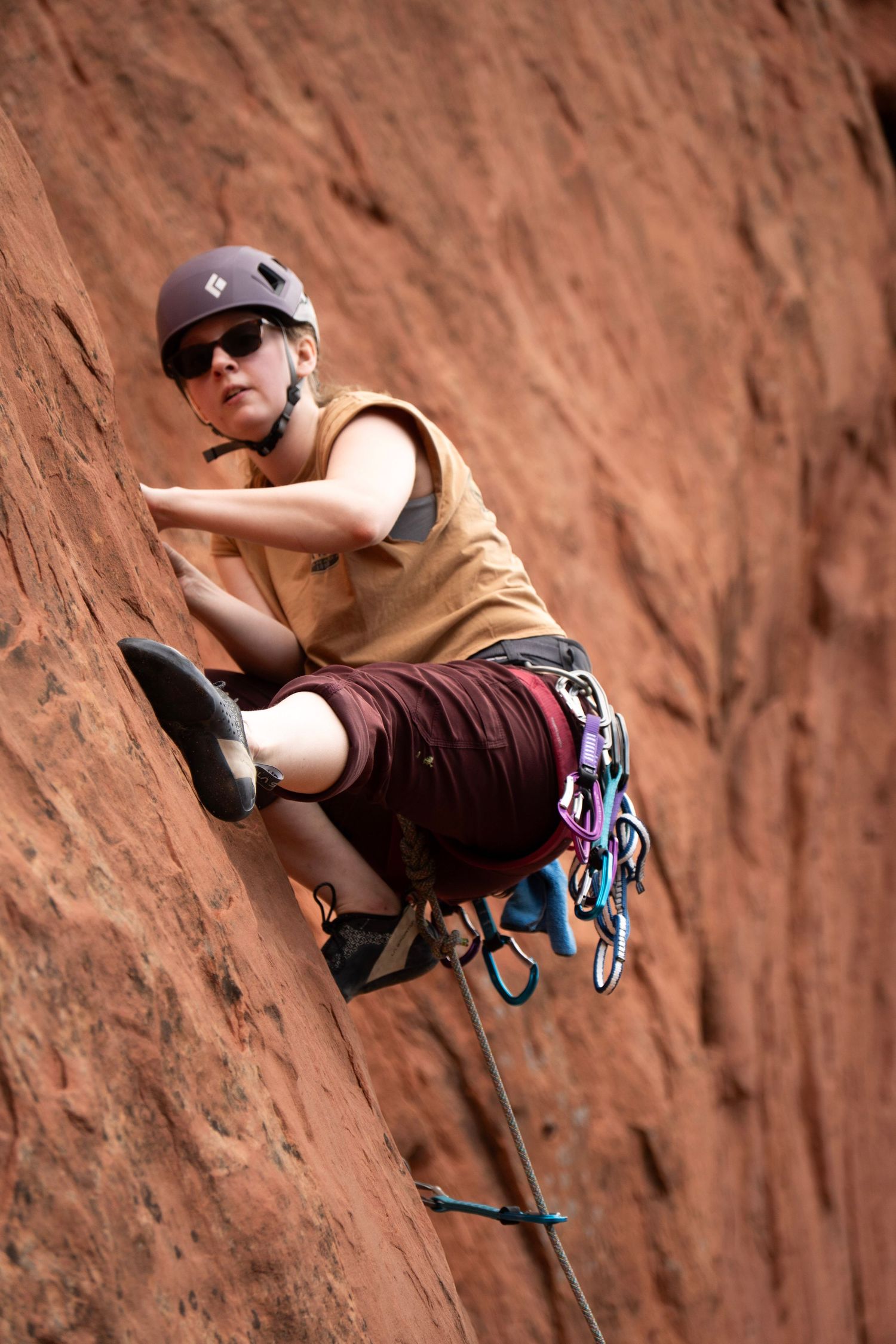 Adventure photography of a person climbing rocks in the Colorado mountains