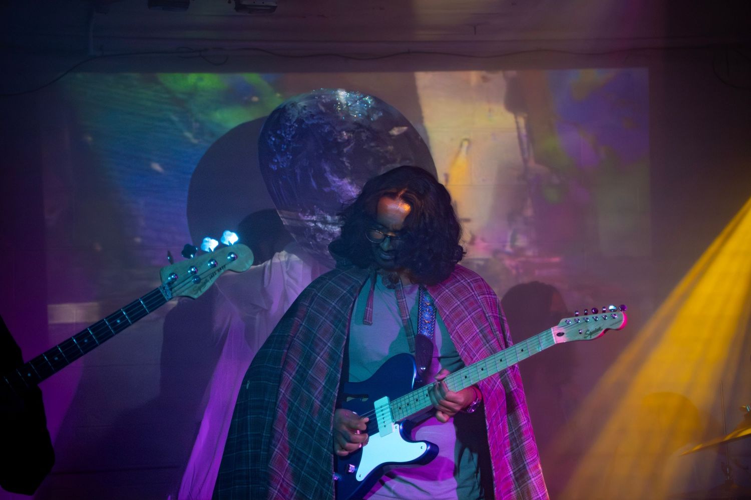 Guitarist jamming out during concert at the DMV