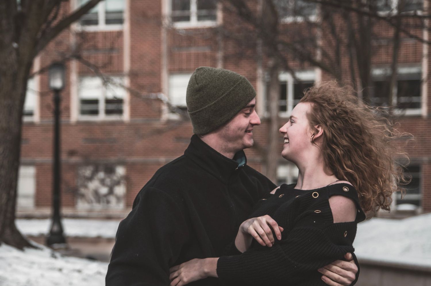 Shay Godfrey capturing a spontaneous moment between a couple outdoors