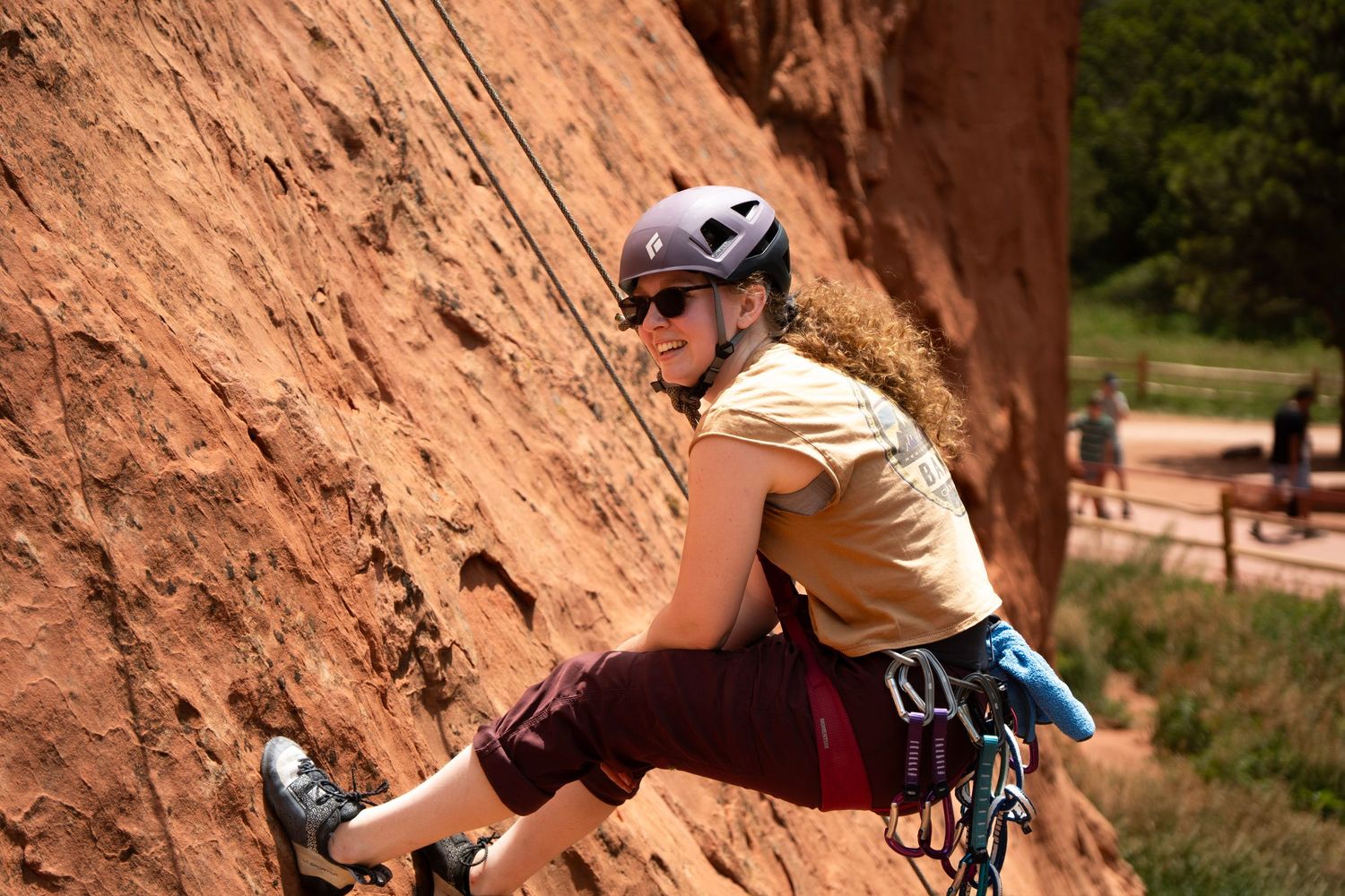 Lifestyle portrait of a person smiling while climbing outdoors in Littleton, Colorado by Shay Godfrey Photography