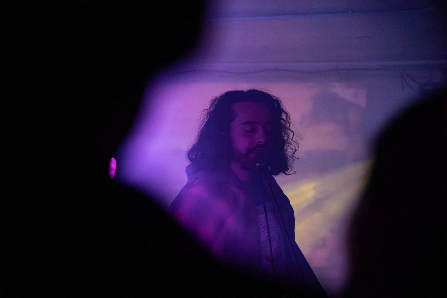 Concert photography capturing energy and movement at a live show of the band Moonshake in Littleton, Colorado