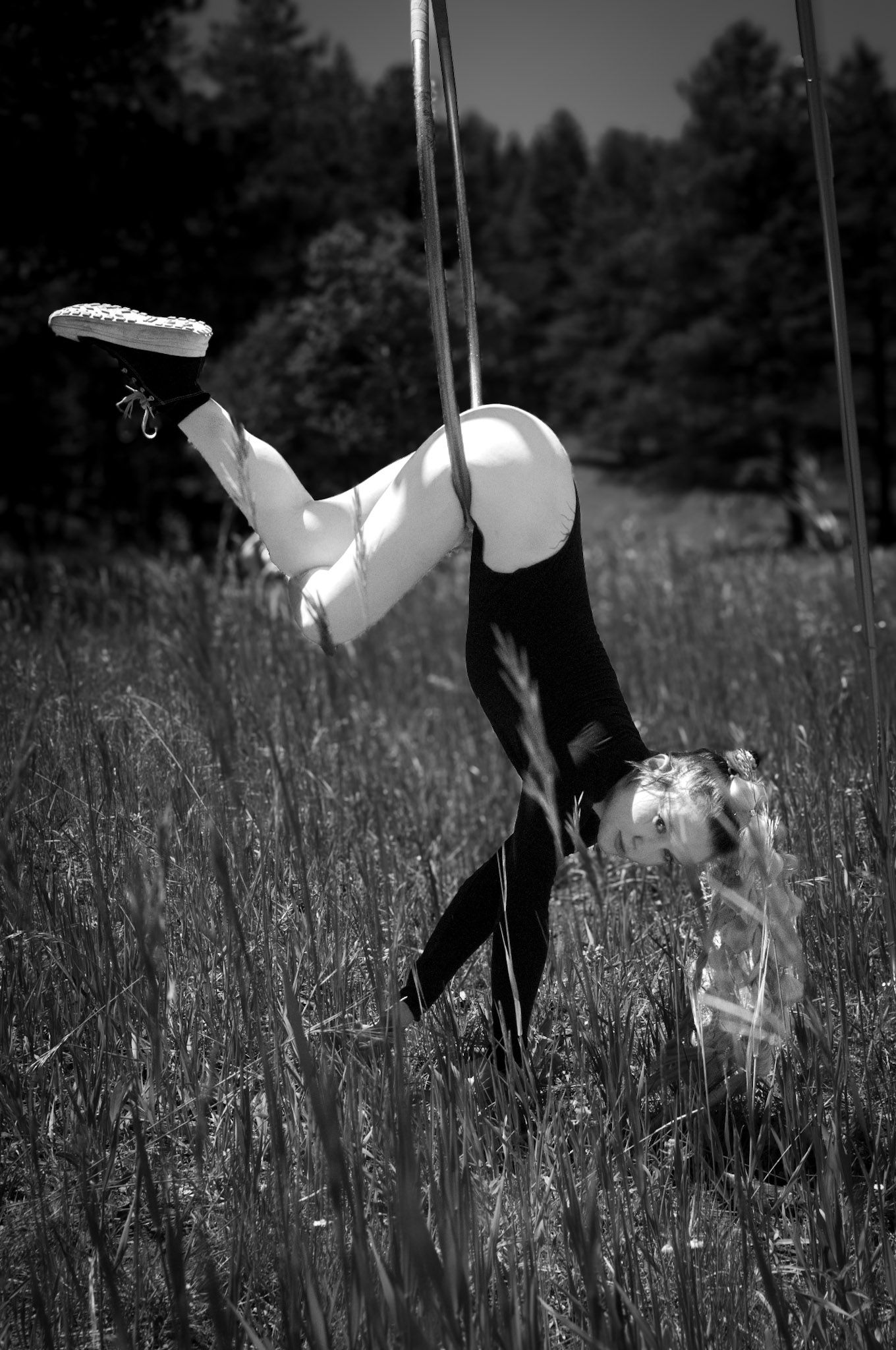 Shay Godfrey capturing a performer on the Lyra surrounded by Colorado wilderness