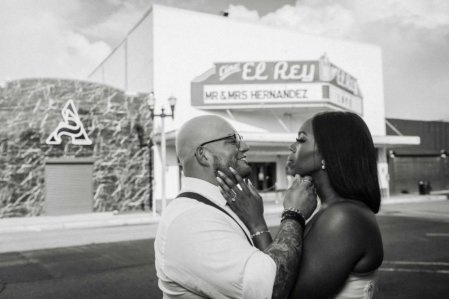 A monochrome image of a couple standing in front of El Rey Mexican restaurant.