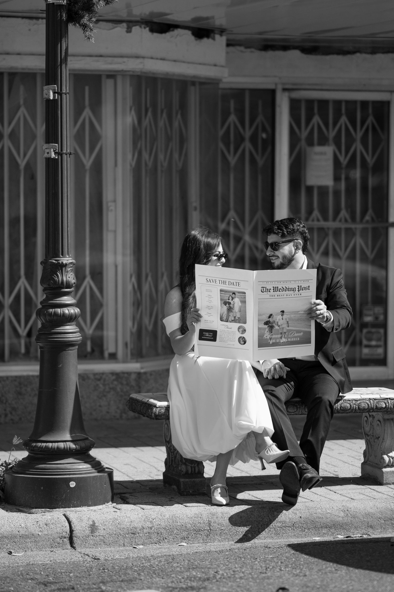 A series of black and white photos showing people reading newspapers while sitting on the ground against a wall.