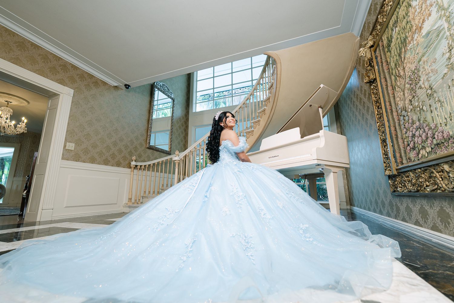 Dramatic sweeping shots of light blue ballgown dress in an elegant indoor setting.