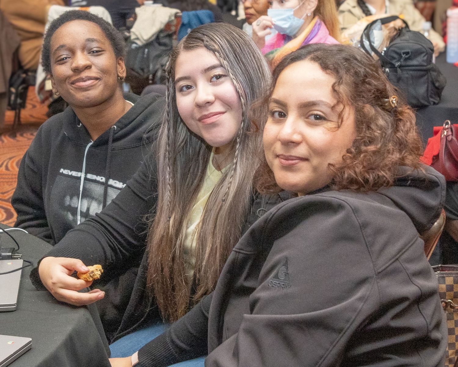 Group of students engaged in friendly conversation at a social gathering.