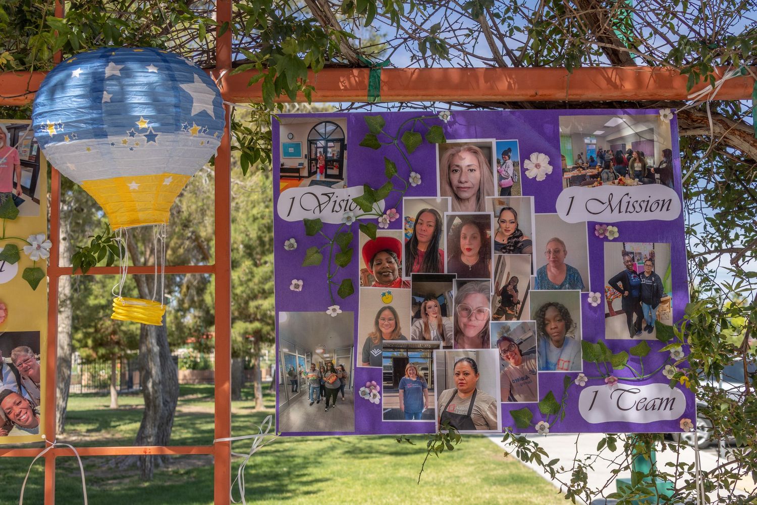 Photo collage display on an outdoor structure with multiple frames showing group activities and memories.