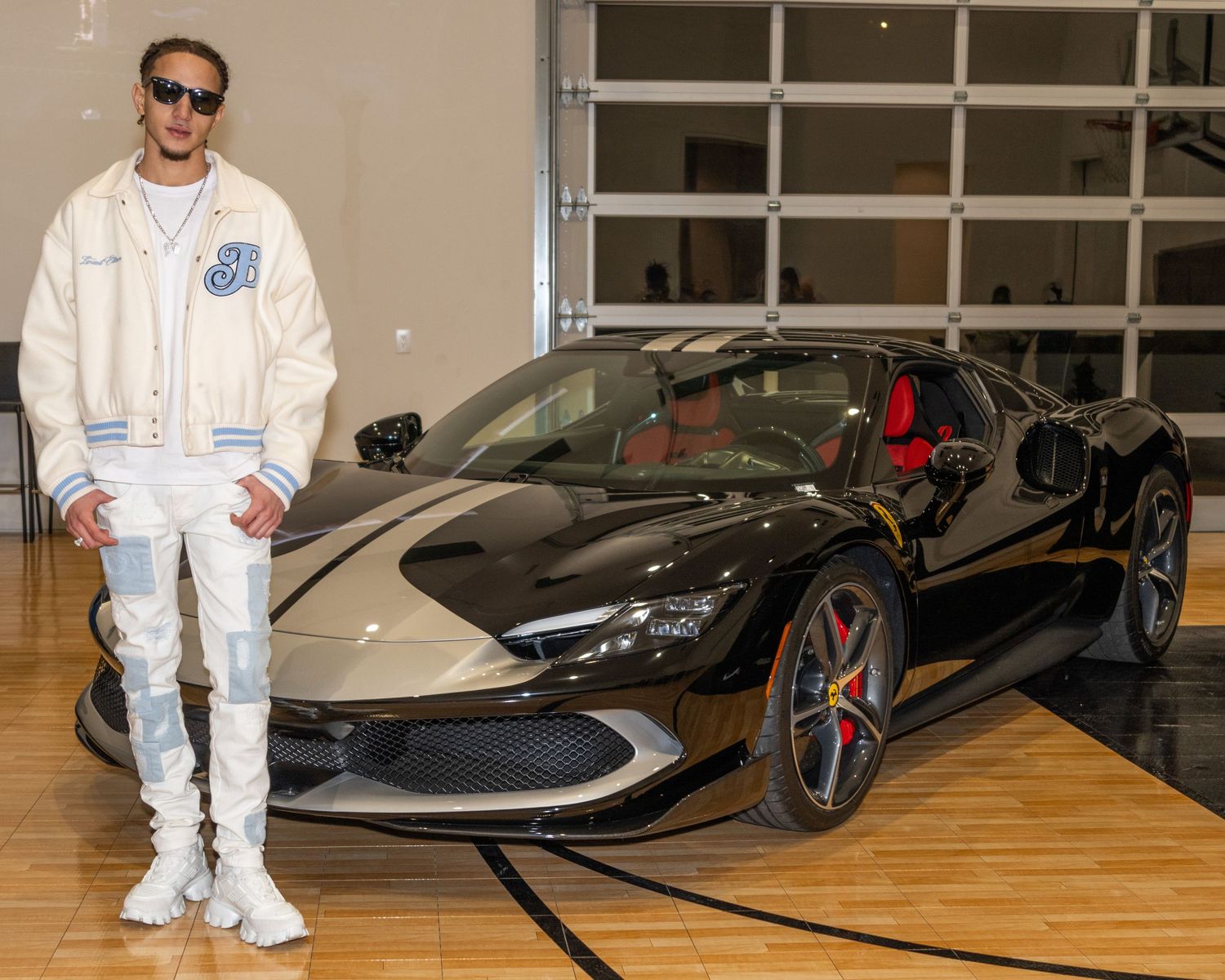 Luxury sports cars on display in a modern showroom with wooden flooring. Only1lacrosse