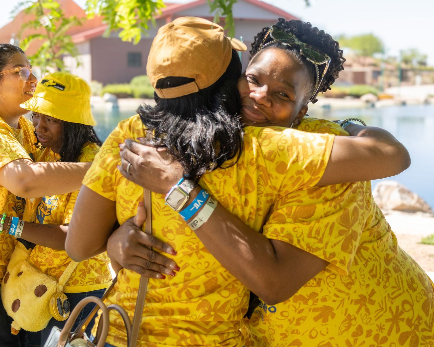 Team members in bright yellow uniforms gathered together for a group photo.