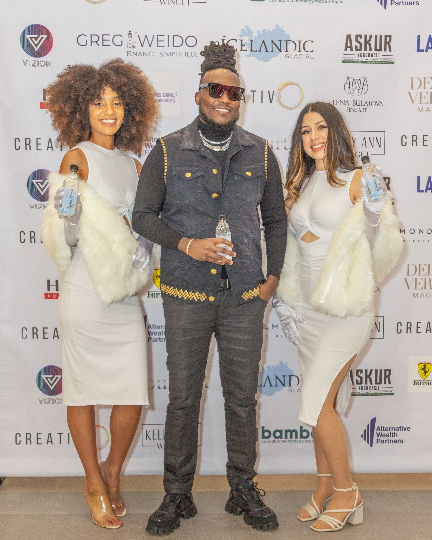 Professional photo backdrop featuring sponsor logos at upscale entertainment event. Tunde Laleye