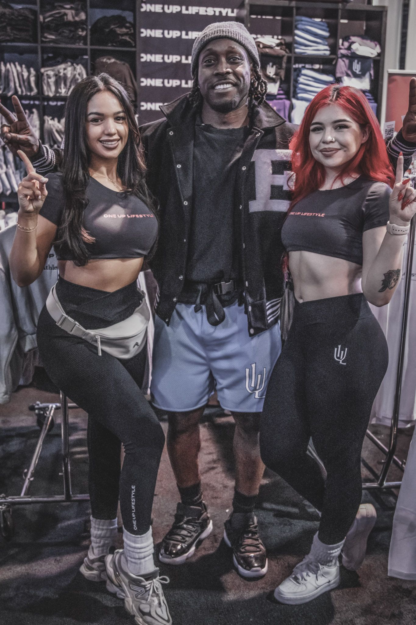 Group of attendees posing together at an indoor retail or promotional event.