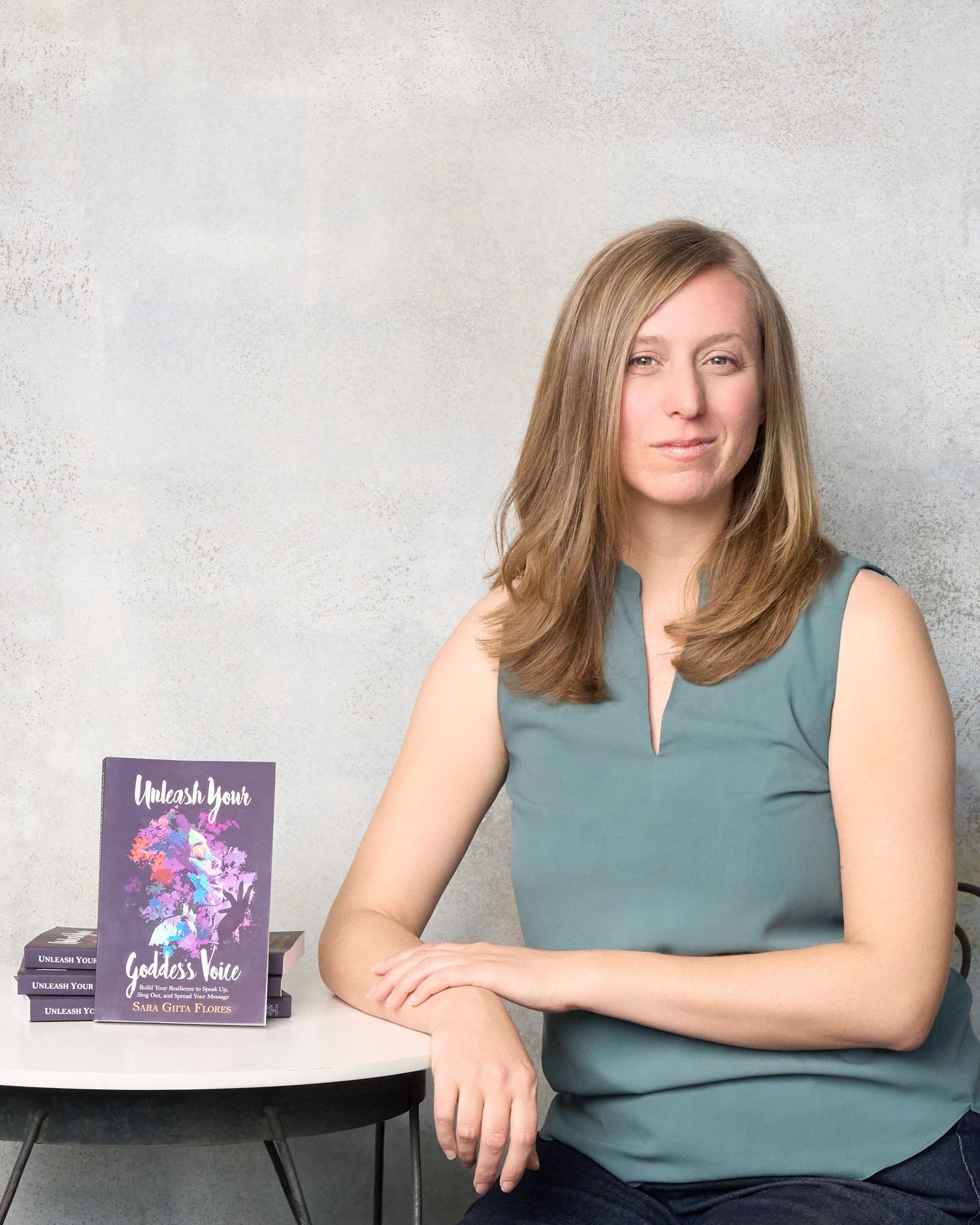 Personal Branding Photography by Rachel McClaskey. Sara with her book, Unleash Your Goddess Voice. Westminster Colorado