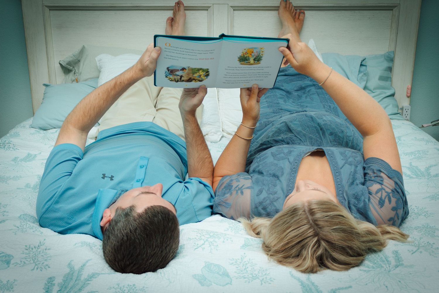 Family members connected in a series of candid moments on blue bedding.