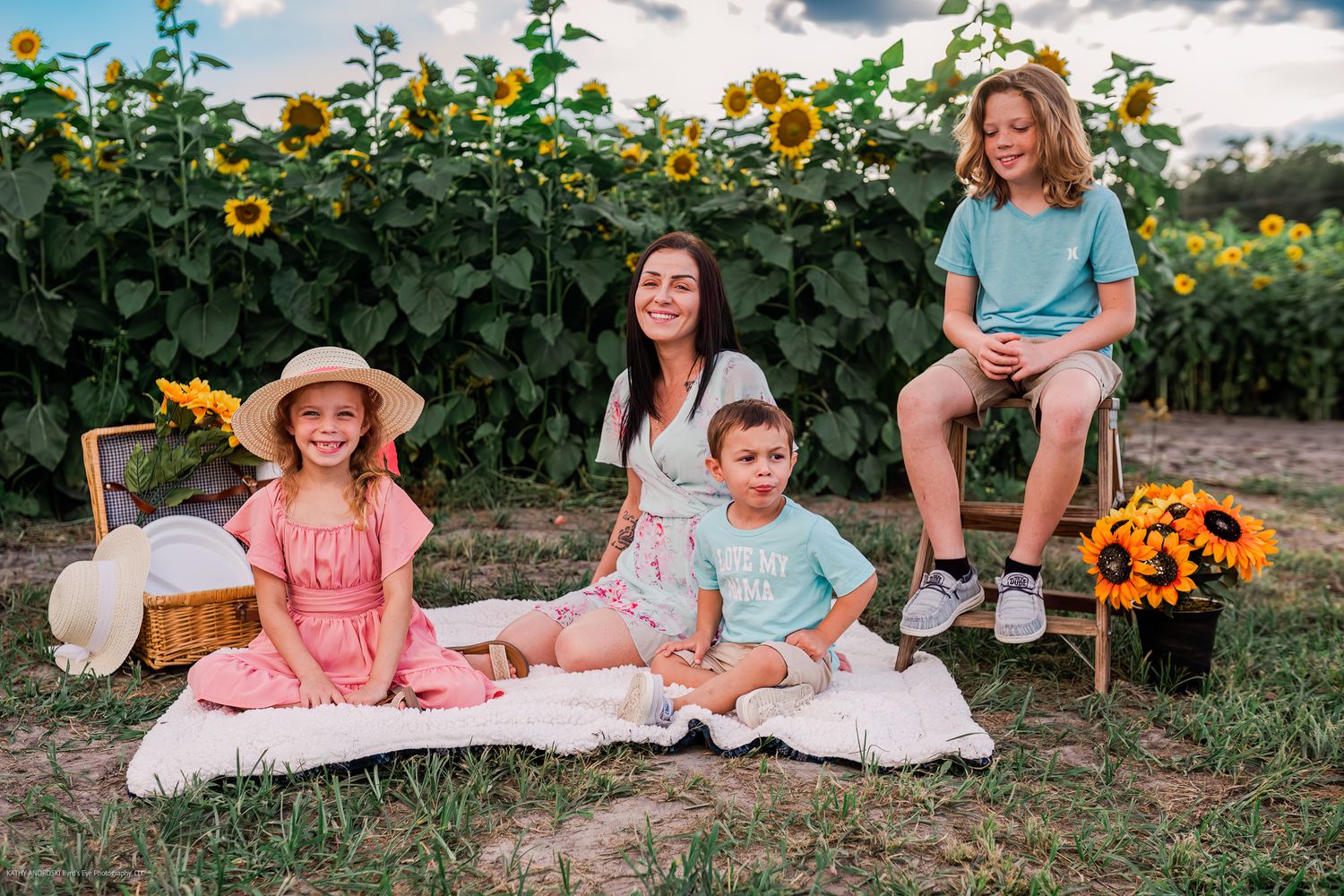 Sun-kissed gathering in a sunflower field on a bright summer evening.