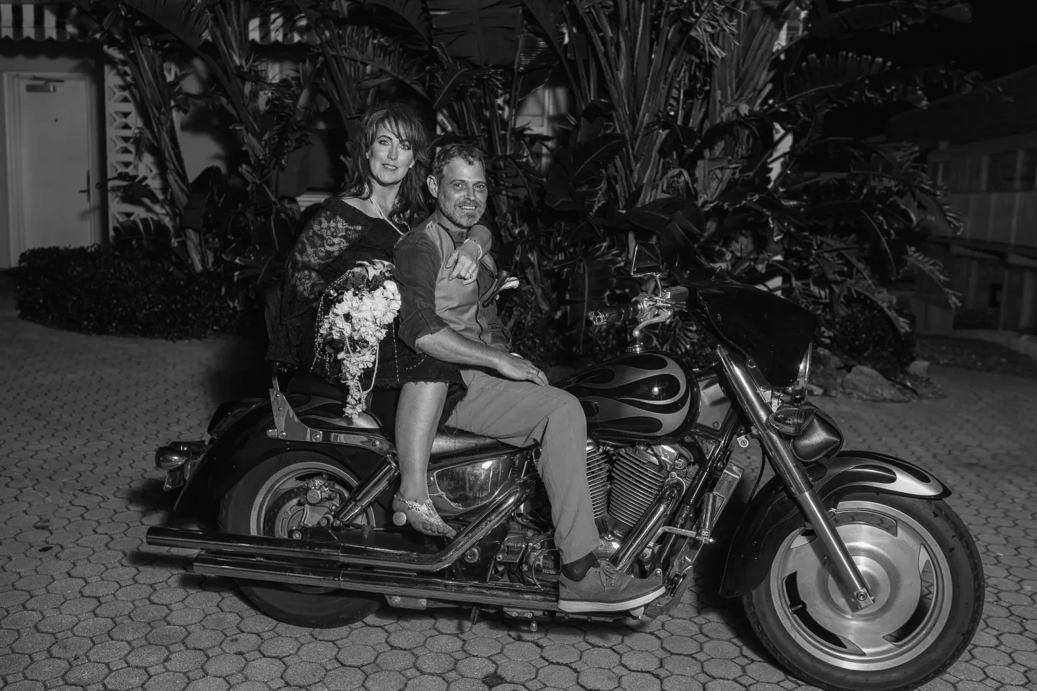 A collection of black and white photographs showing vintage motorcycles and people posing with them.