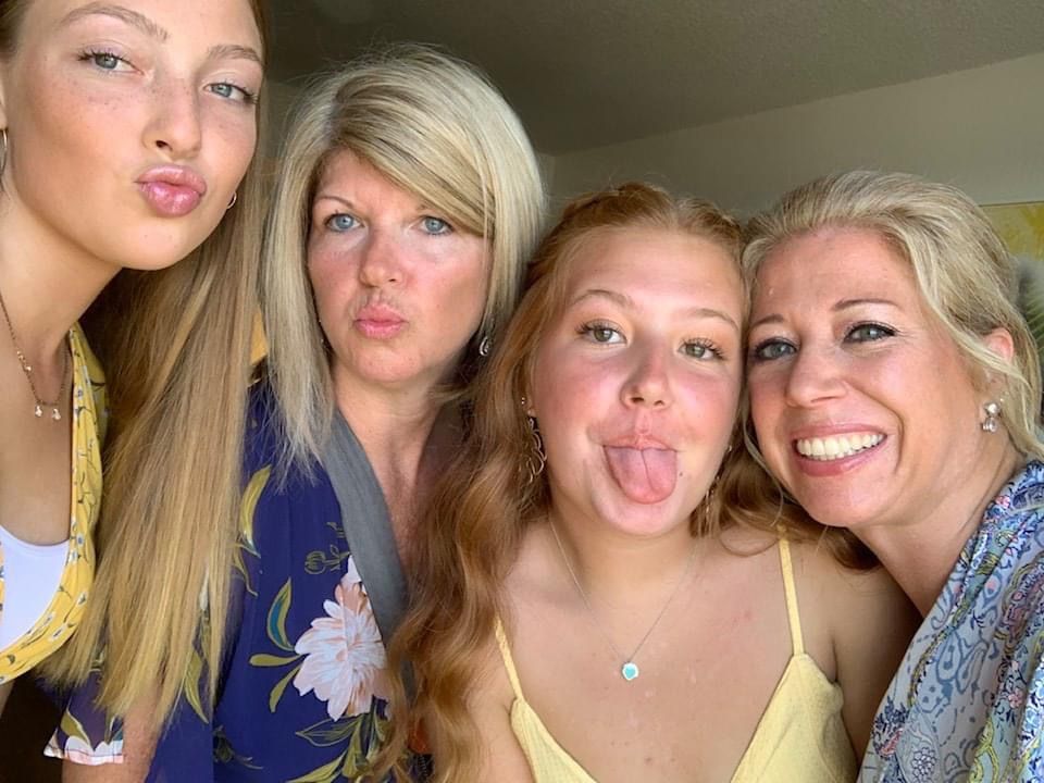 Group selfie showing playful expressions and friendship before the wedding begins!