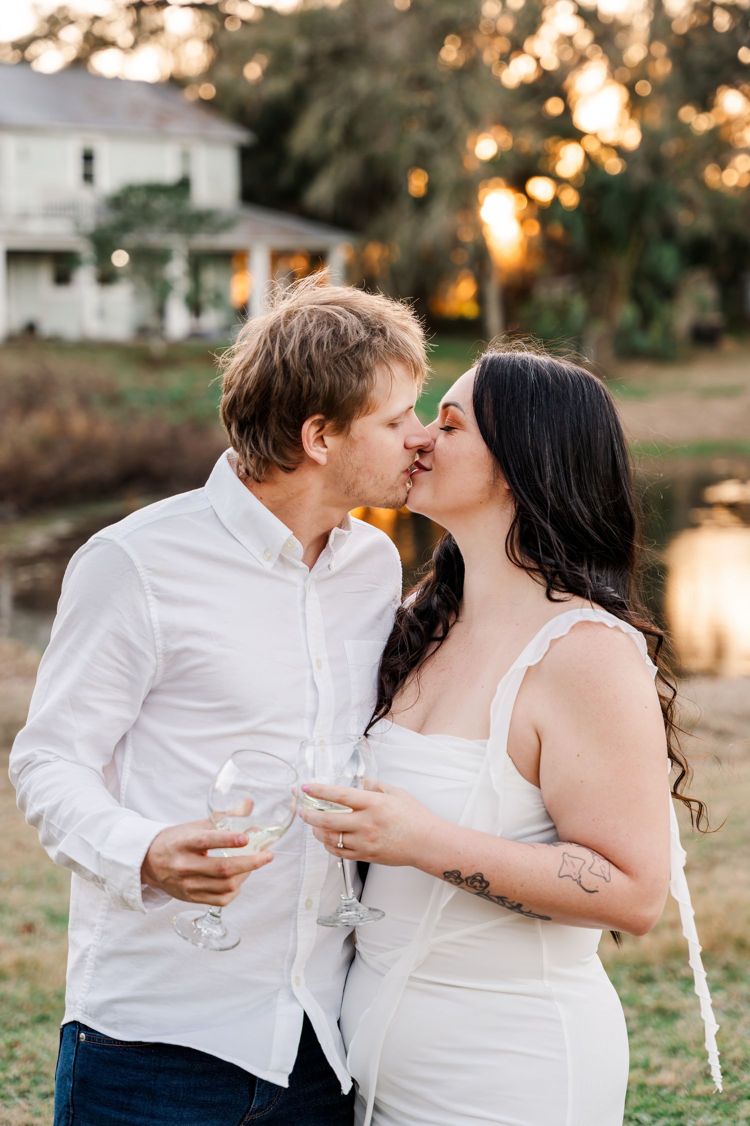 A couple shares romantic moments at sunset in a series of intimate wedding photos with glowing bokeh lighting.