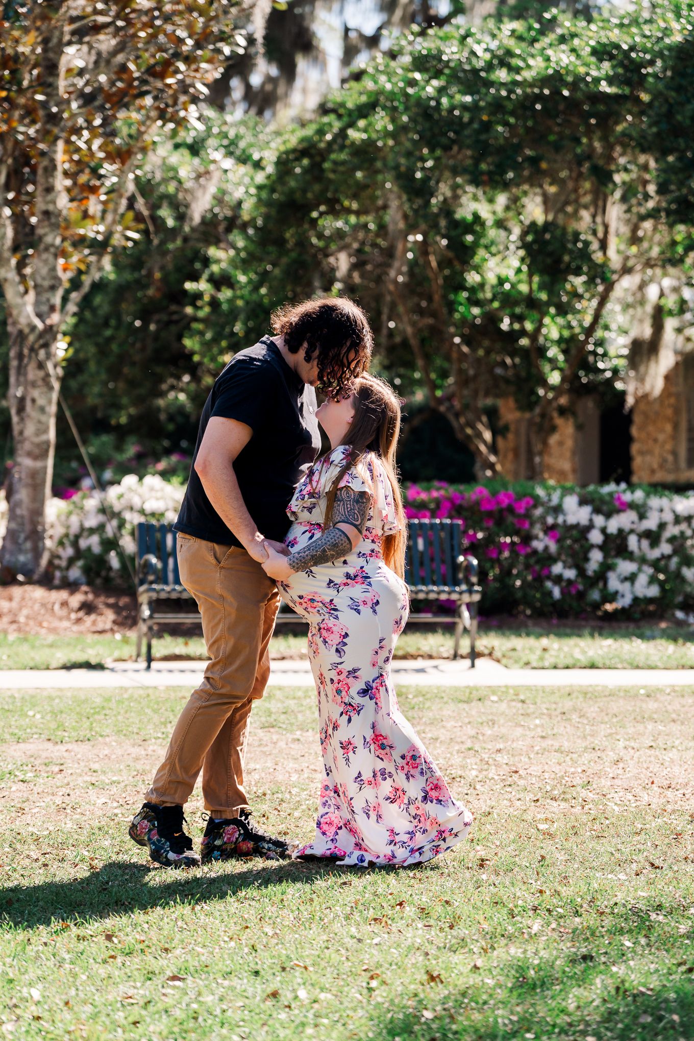 A sequence of romantic dance moves captured in a sunlit garden with blooming flowers and trees in the background.