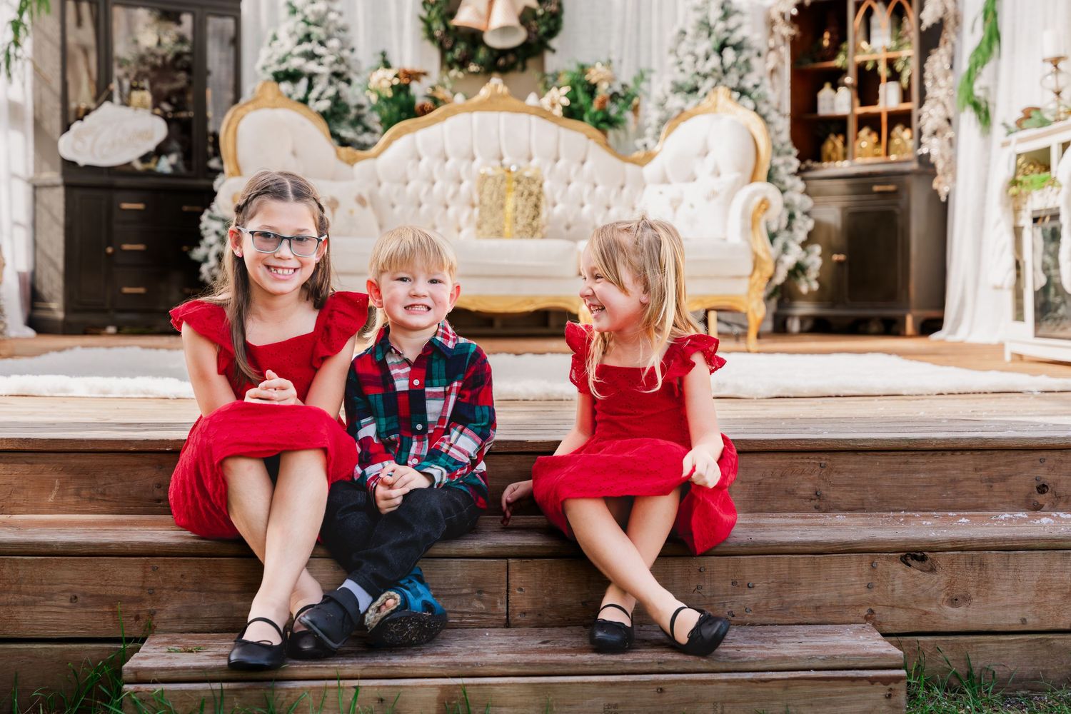 Six connected photos show festive holiday scenes with children in red dresses and formal wear sitting on wooden steps.