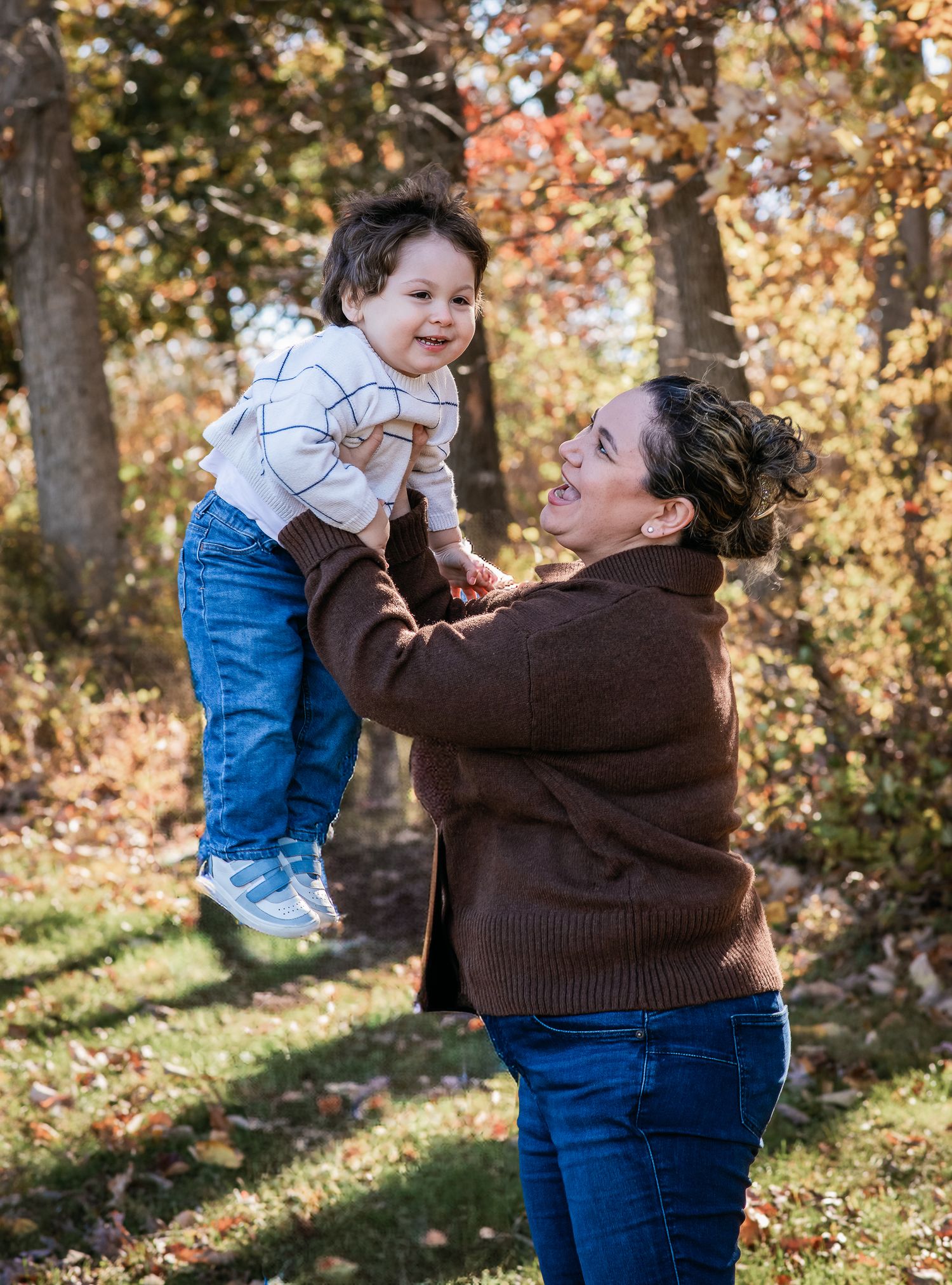 Playful autumn moment captured in a series of photos showing joyful interaction against a backdrop of fall foliage.