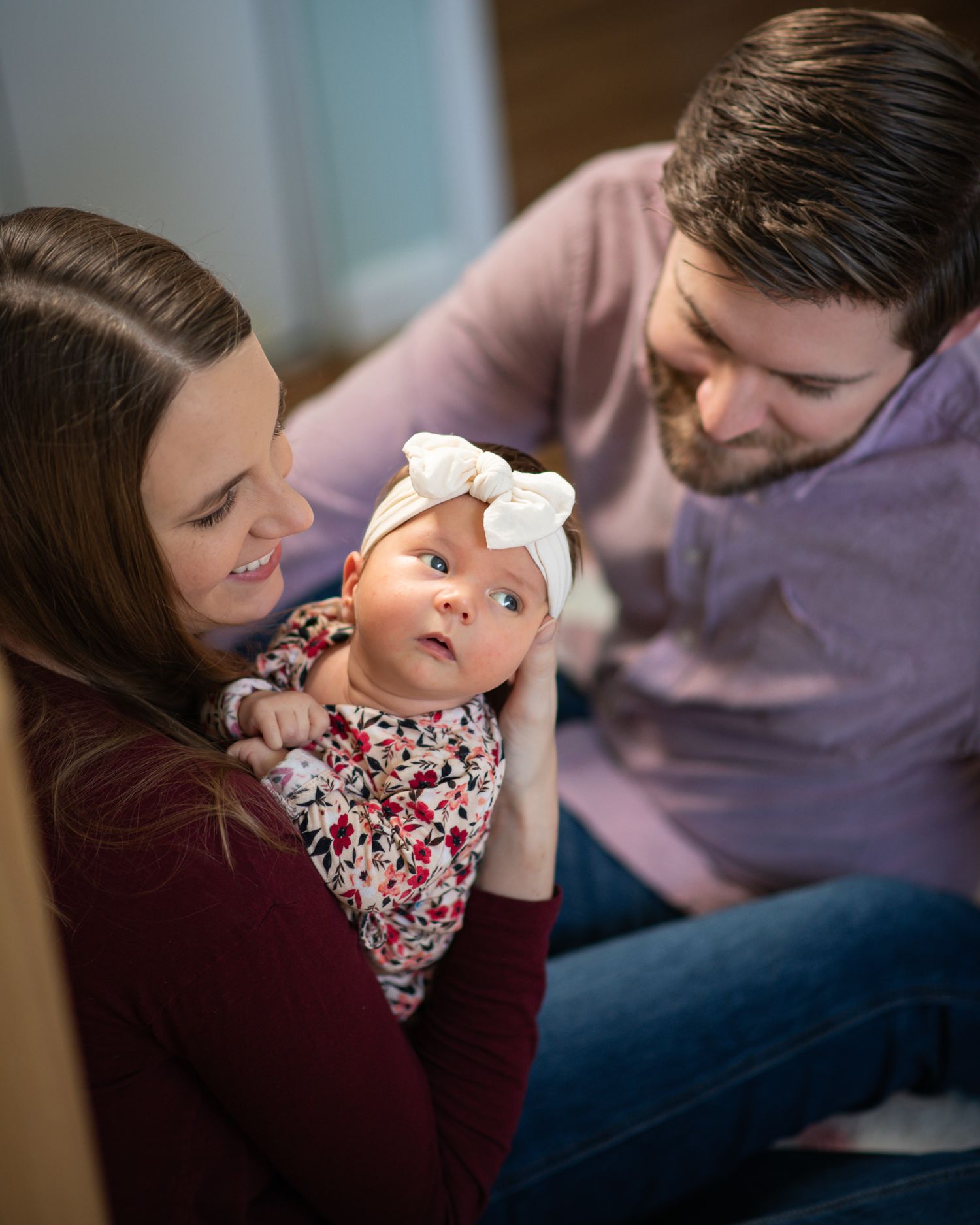 A family shares tender moments with their baby in a series of candid photos showing affection and bonding.