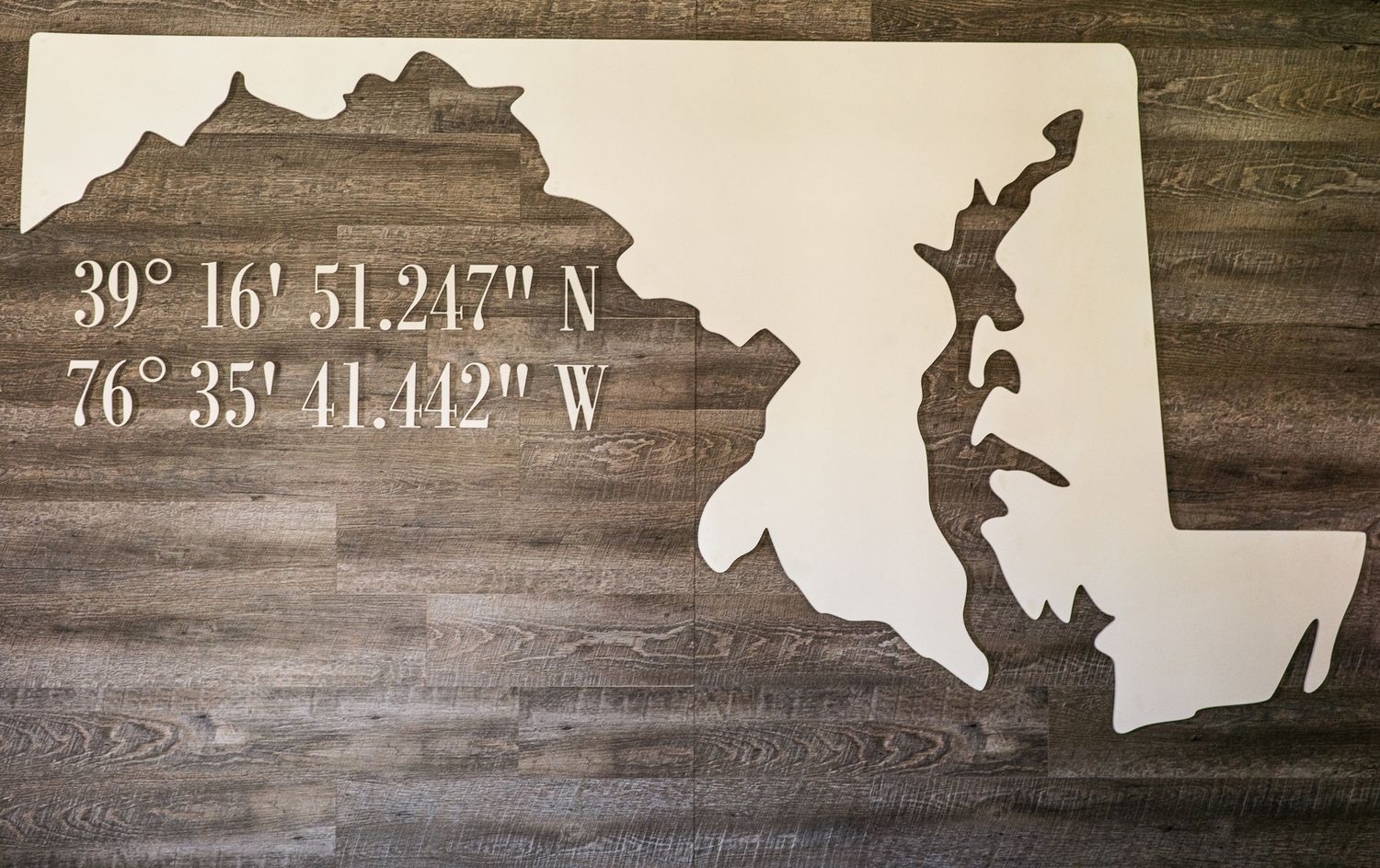 White wooden Maryland state shape wall art with GPS coordinates 39°16'51.247