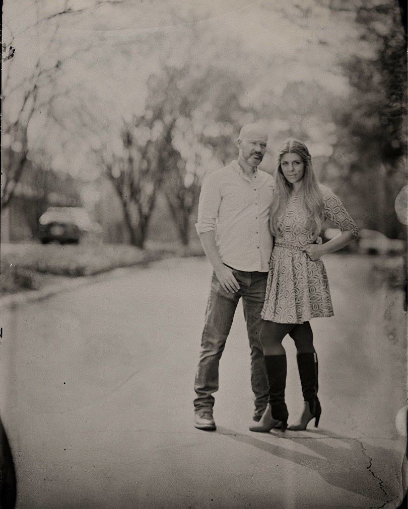 tintype engagement portrait of a couple standing on a street