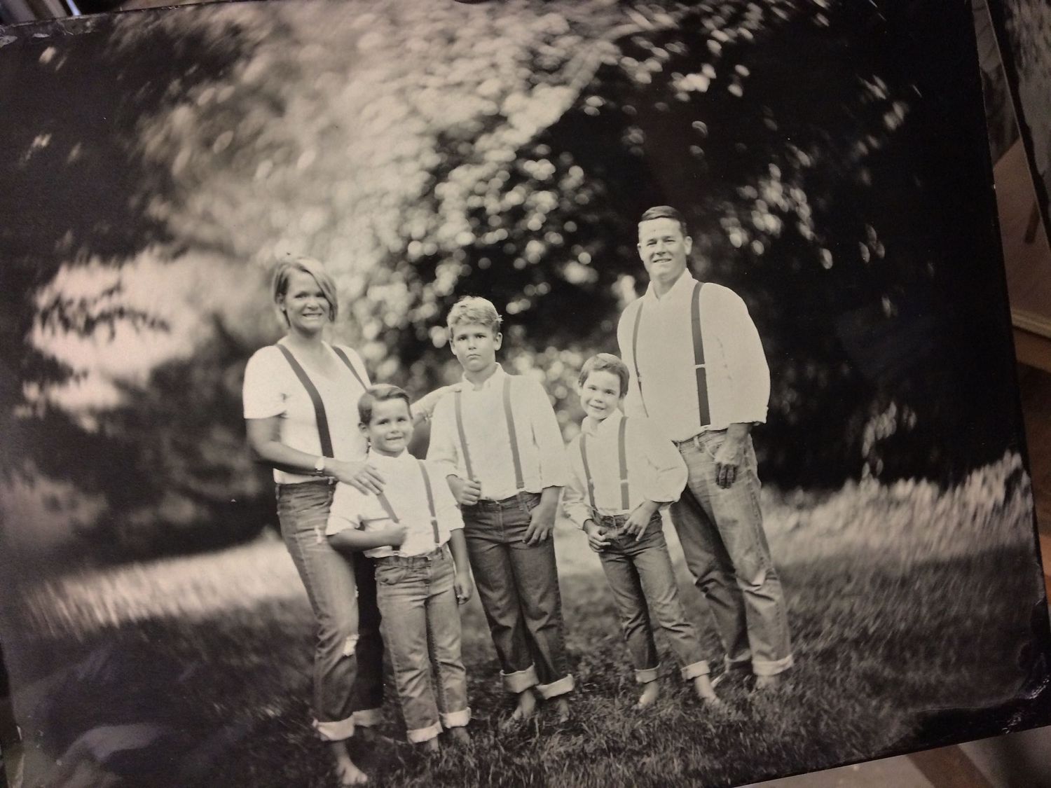 tintype of family wearing jeans and white shirts