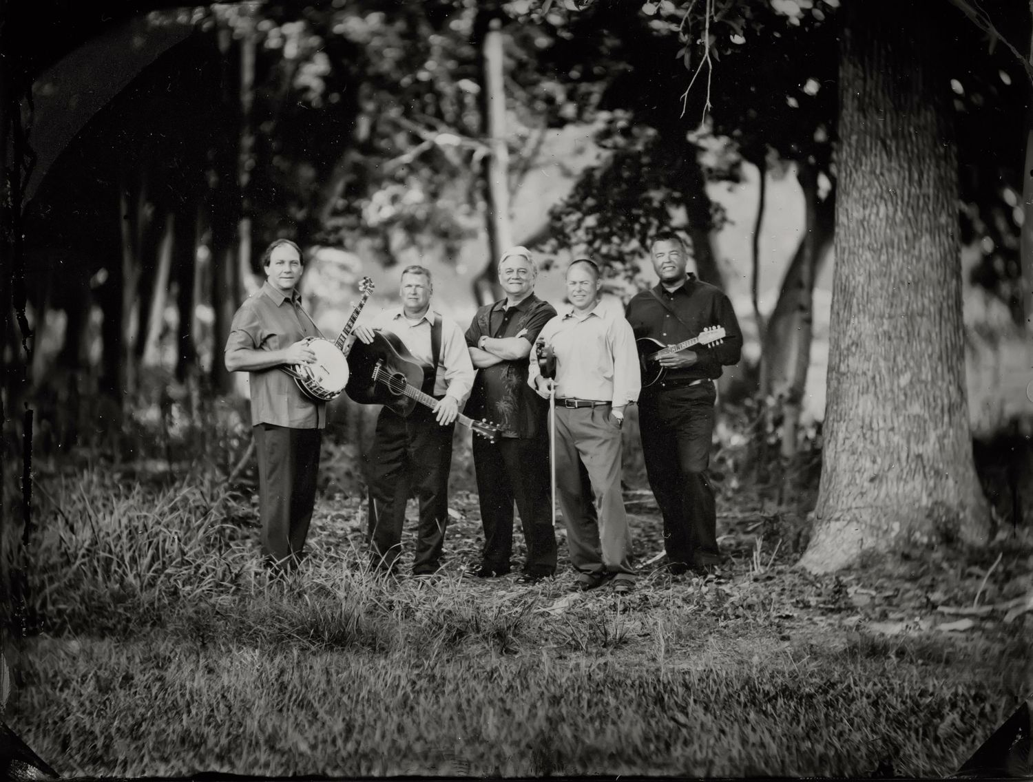 tintype portrait of bluegrass band on a woodbine