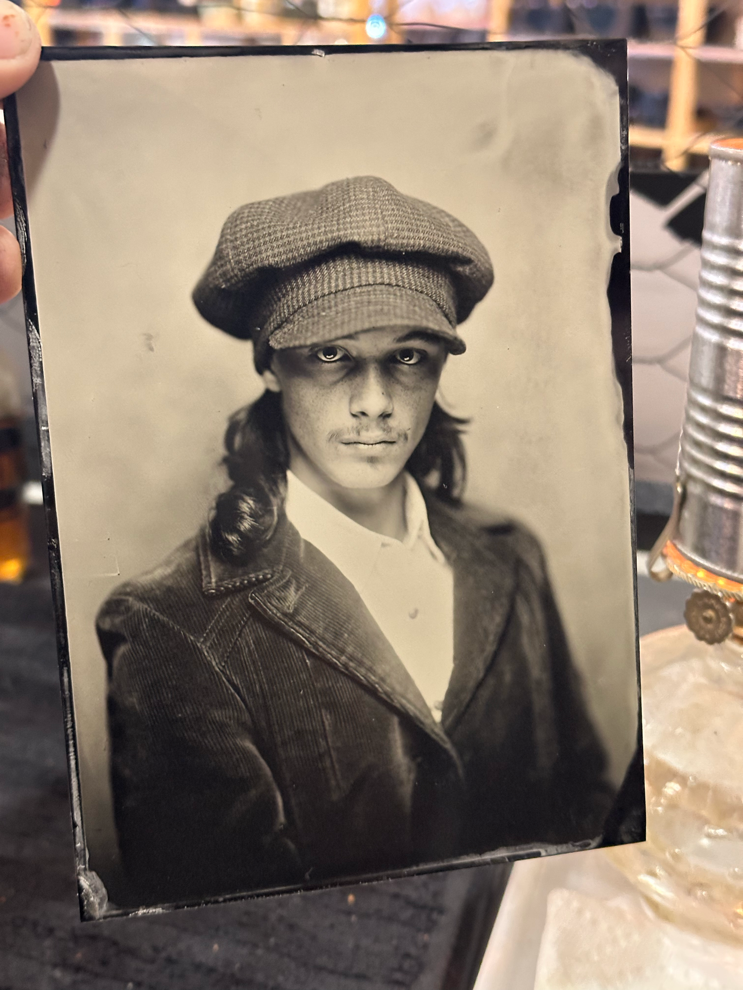 tintype of young man with vintage 1970's coat and hat