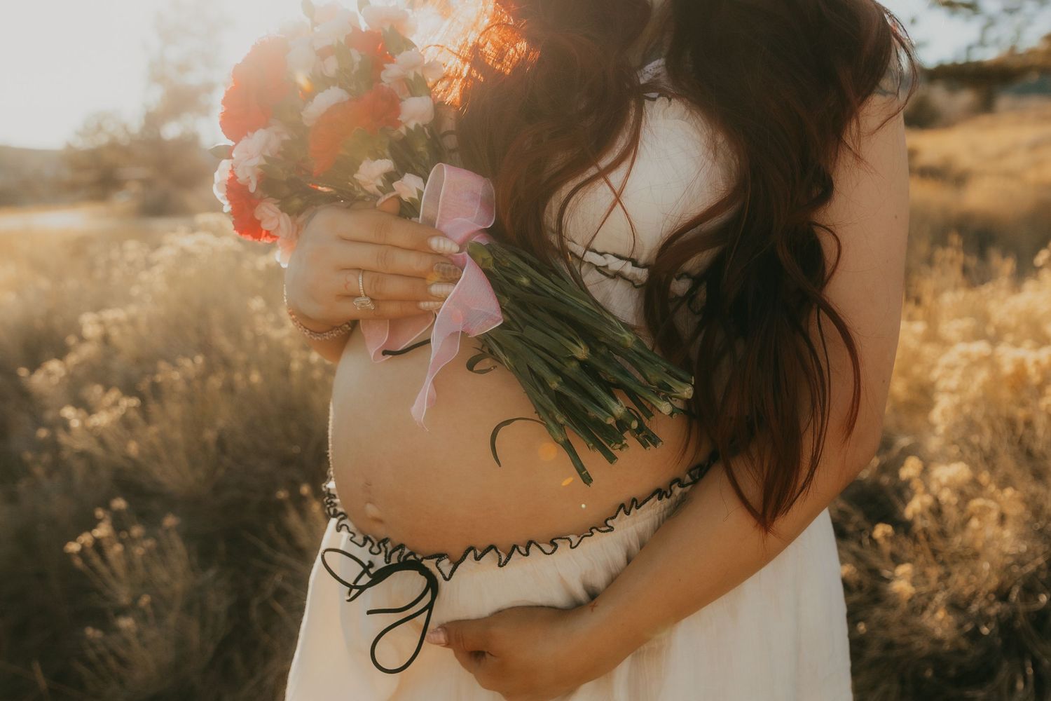 golden hour photoshoot in a sunlit meadow with warm autumn tones.