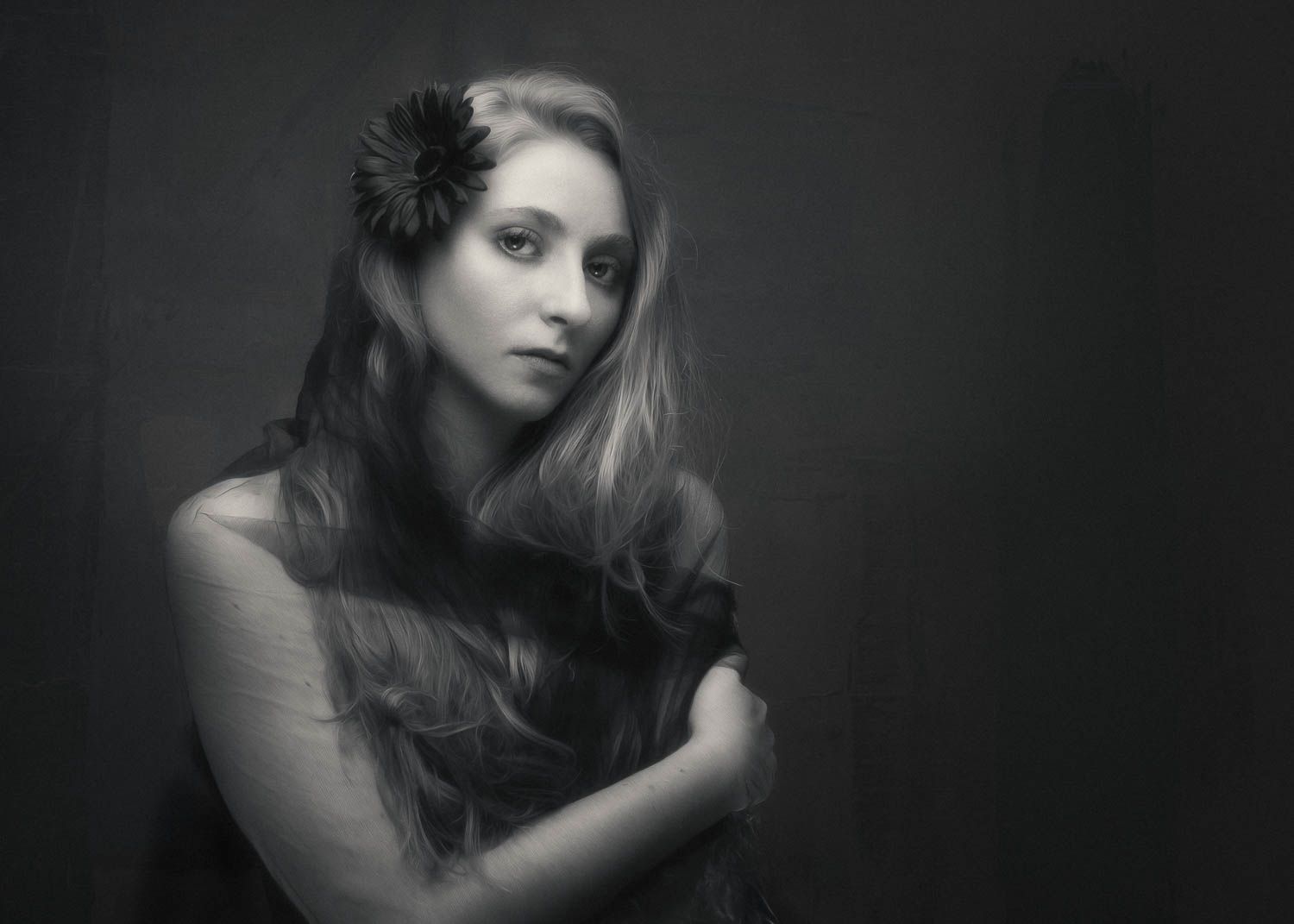 Creative black and white portrait of young woman with blonde hair in studio