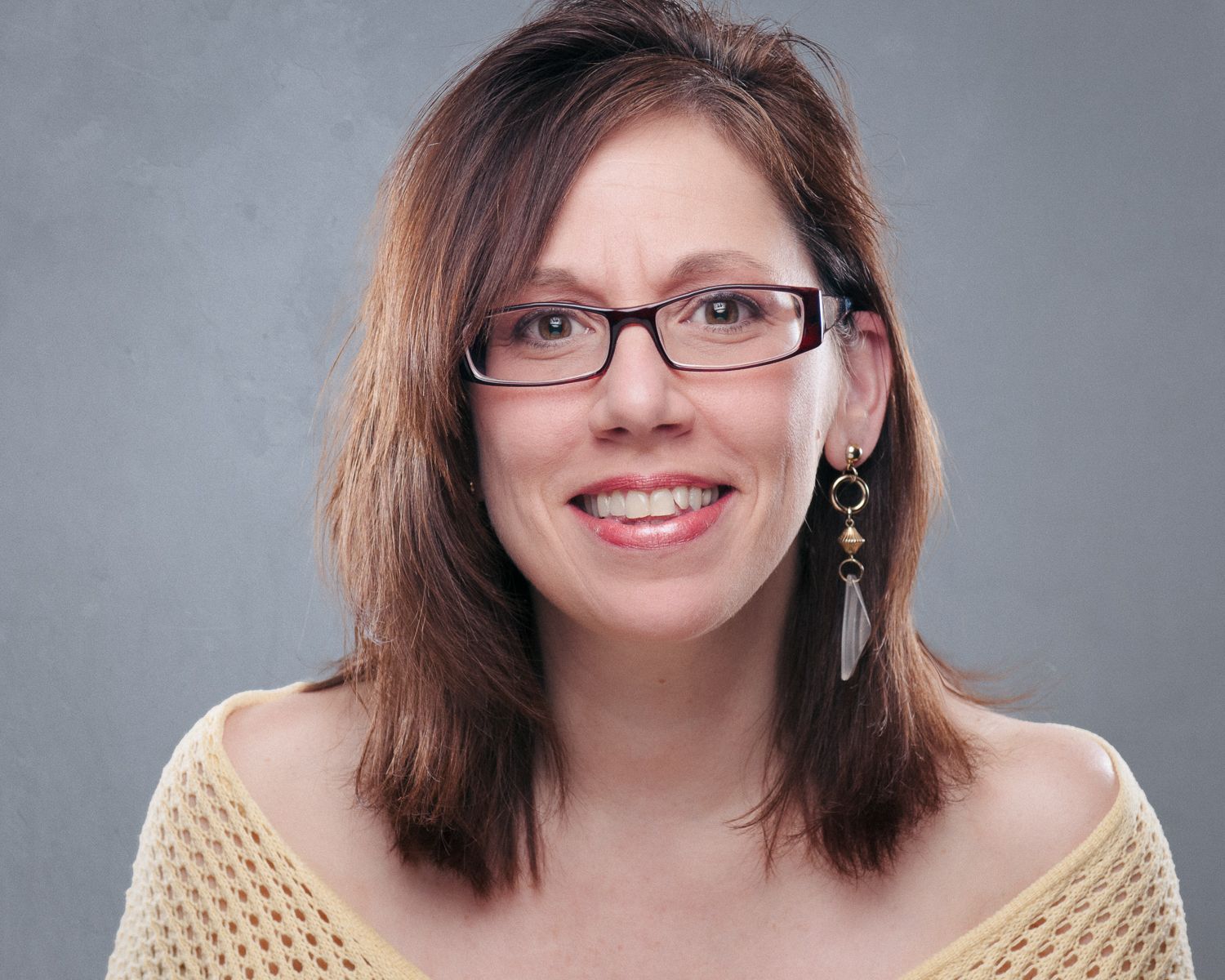 Head shot of a woman with brown hair