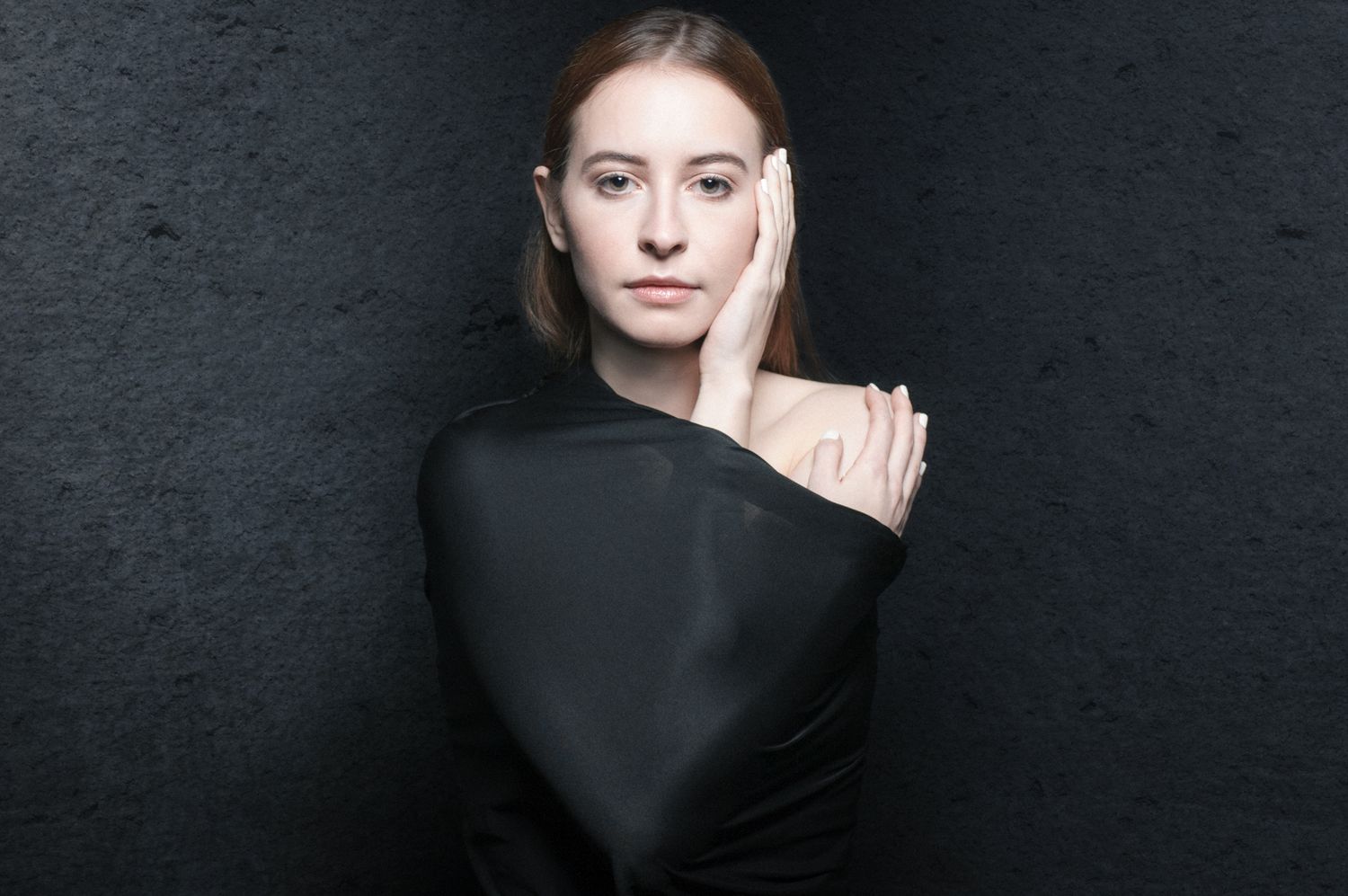 Stylized creative portrait of young woman in studio