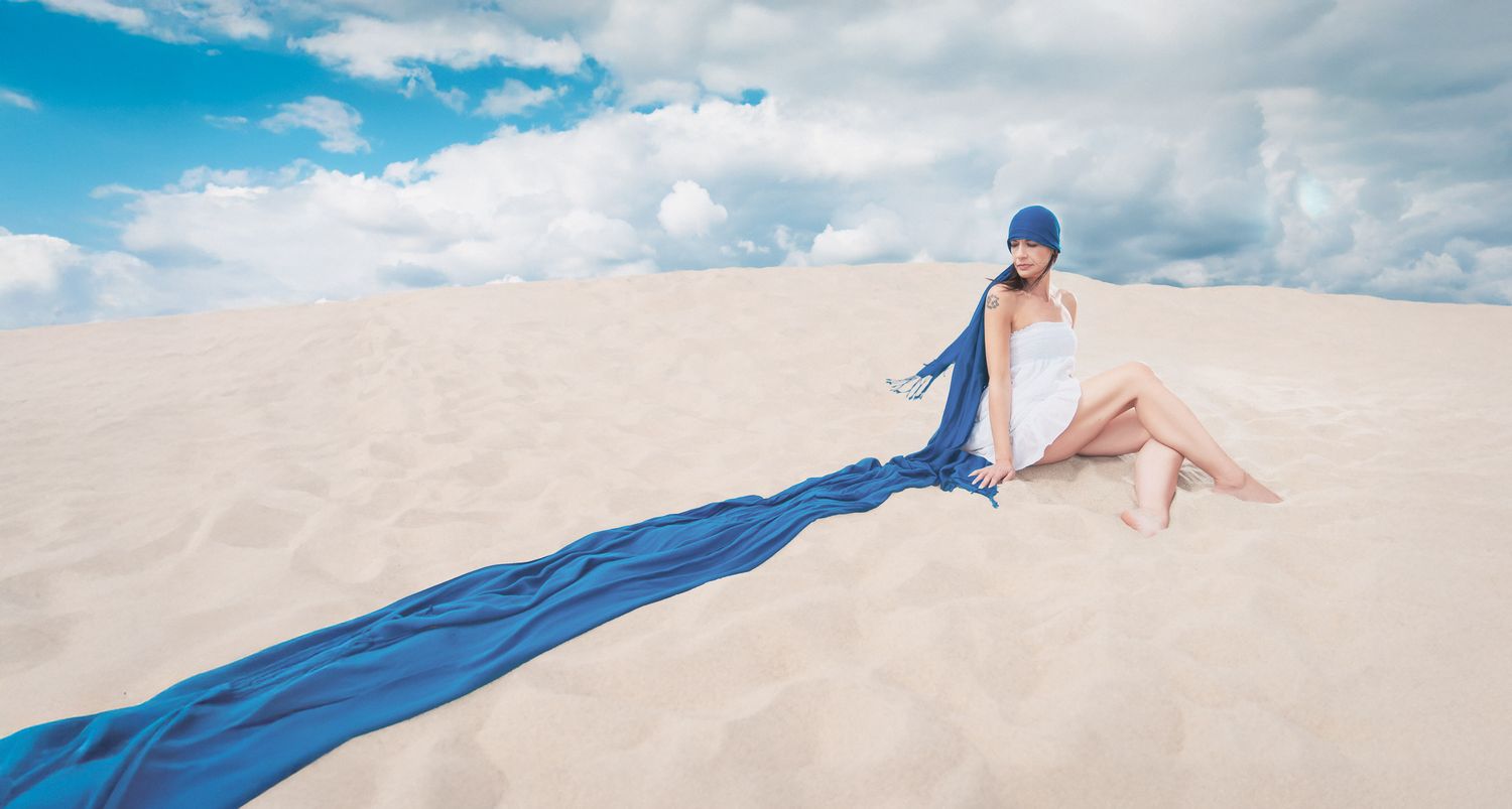 Lifestyle photo of a young woman at the beach.