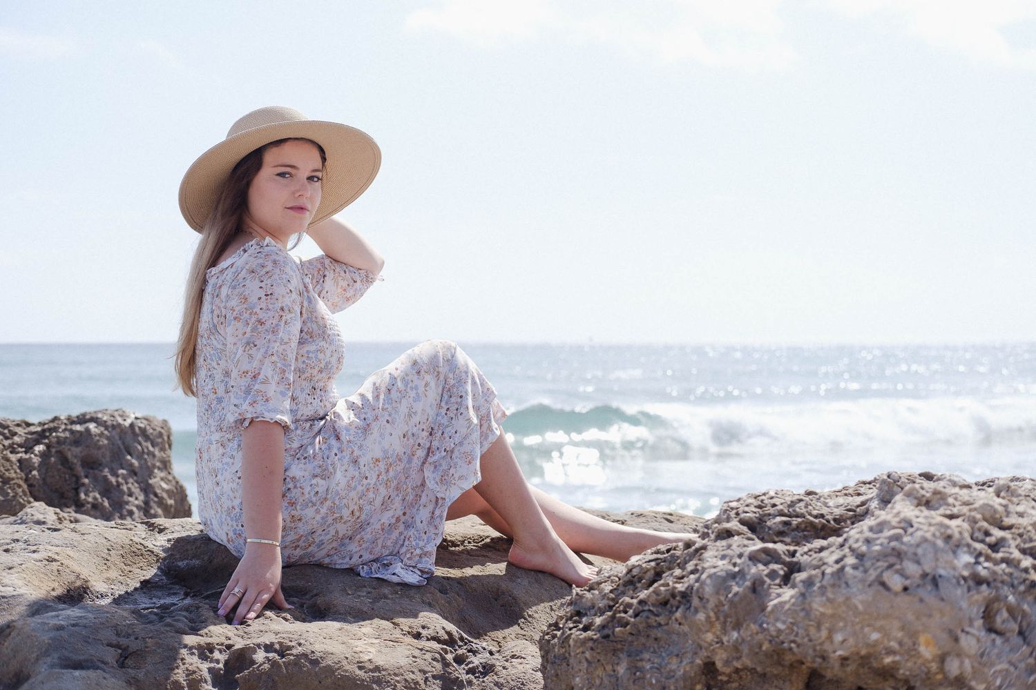 Lifestyle photo of a young woman at the beach.