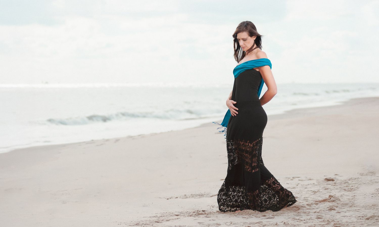 Lifestyle photo of a young woman at the beach.