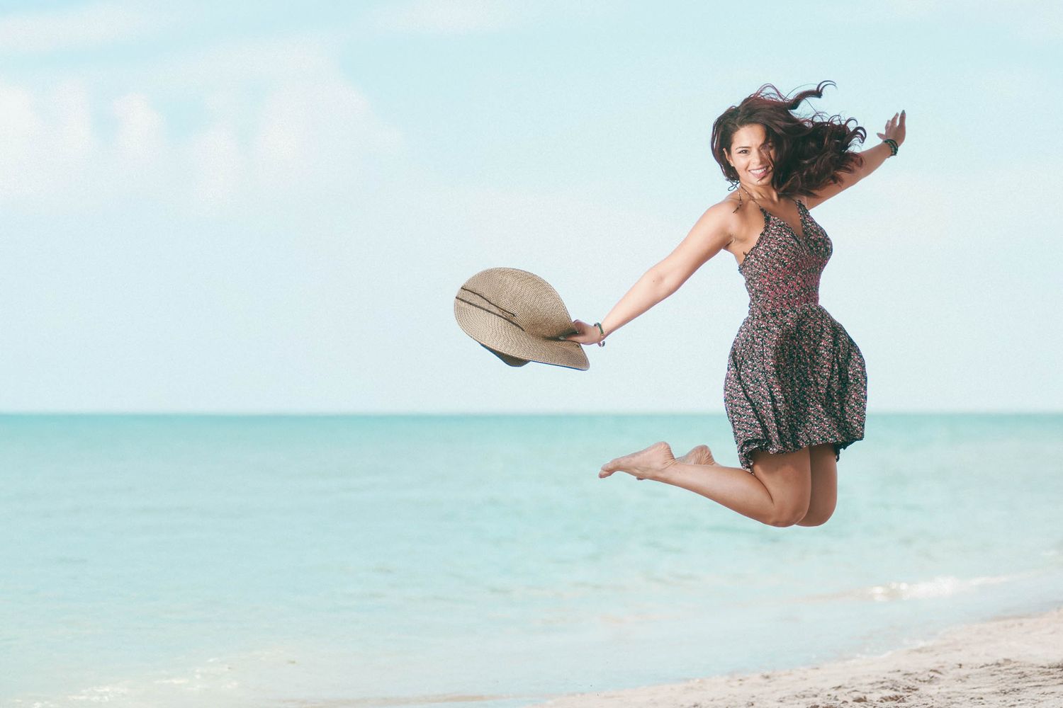 Lifestyle photo of a young woman at the beach.