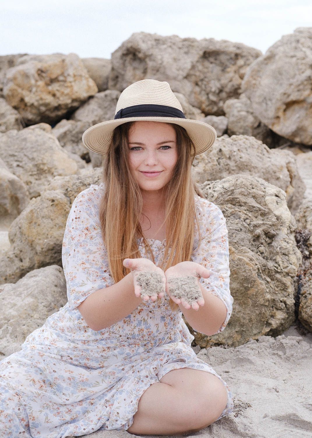 Lifestyle photo of a young woman at the beach.