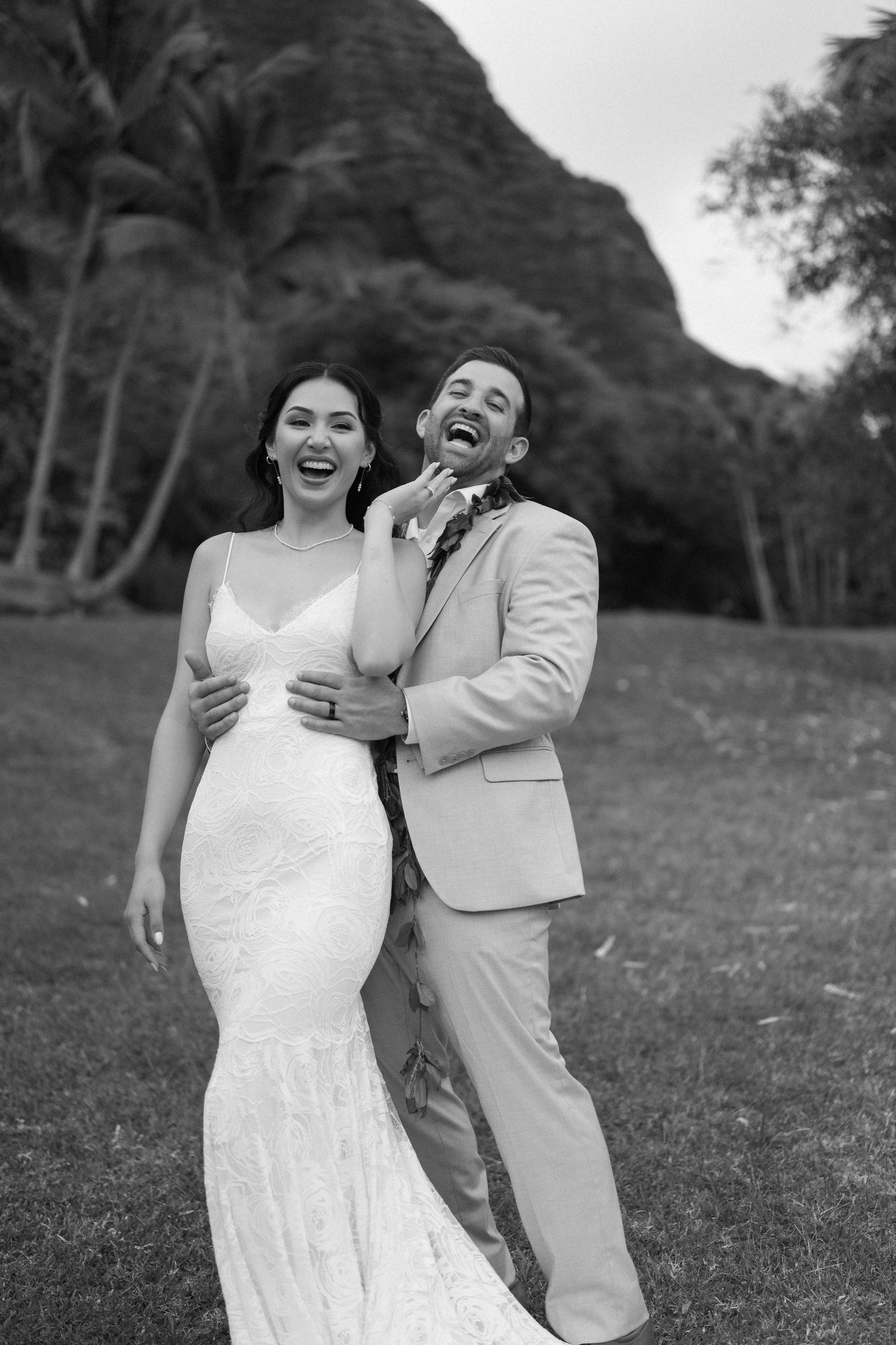 Black and white photos capture joyful moments between a couple on their wedding day.