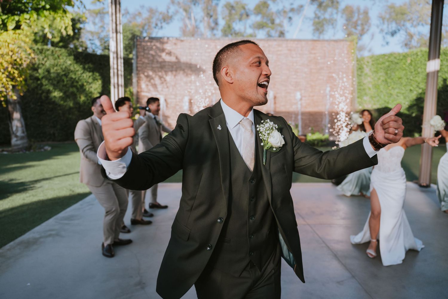 Wedding guests mingle and celebrate during an outdoor reception.