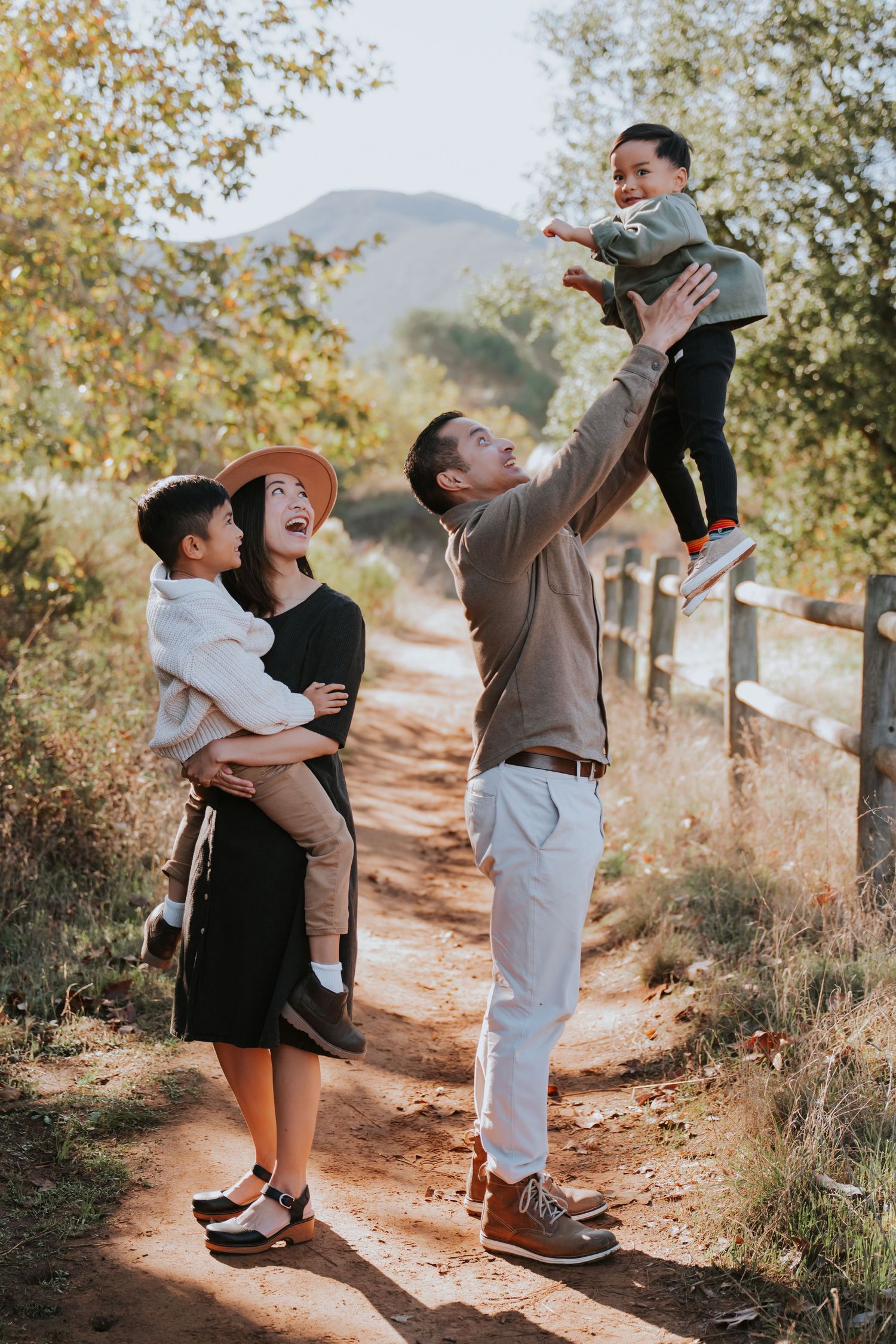 Sequence of heartwarming moments on a mountain trail showing playful interactions between two people in casual attire.