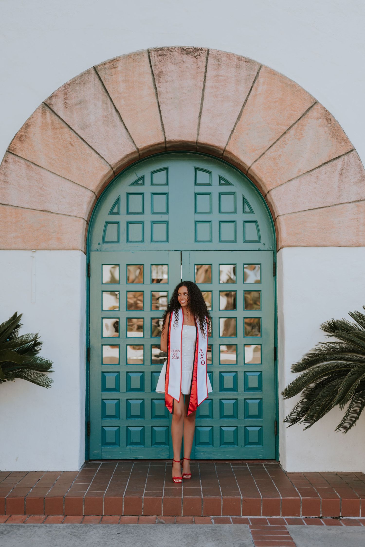 A sequence of four photos showing a turquoise arched door with decorative glass panels against a white stucco wall.