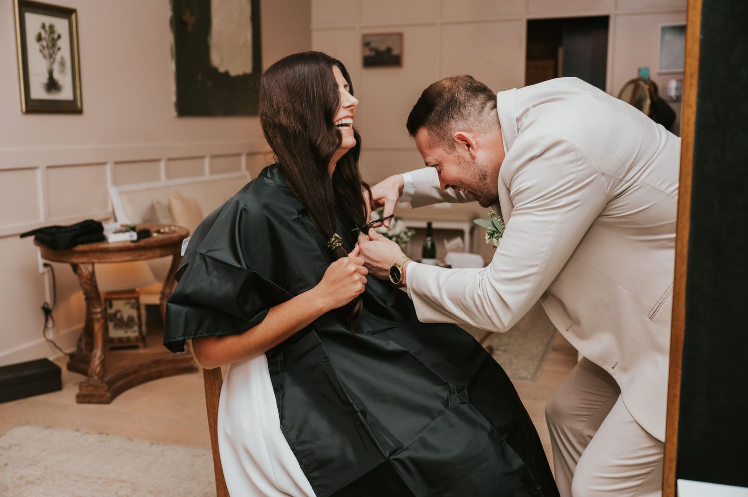 Healthcare professional in white coat performs chiropractic adjustment on patient lying on treatment table.
