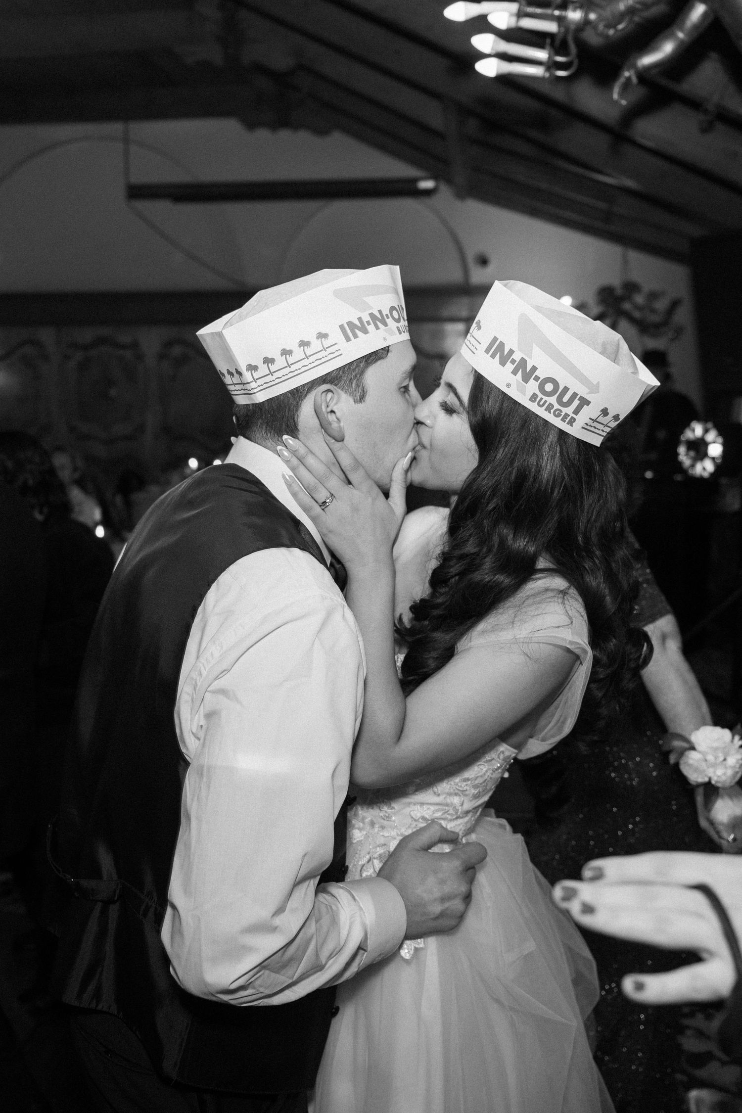 A series of black and white photos showing a couple in sailor uniforms sharing romantic kisses.
